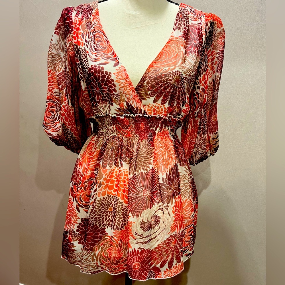 Worn once- size Med. Beautiful red tones, blouse